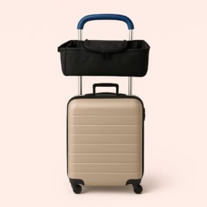 Enhanced Barnevognstaske i Sort - Perfekt til Rejse og Hverdag med Praktiske Rum. The stroller bag is neatly organized atop a stylish airport luggage trolley, with a family preparing for travel in a bustling, well-lit airport terminal.